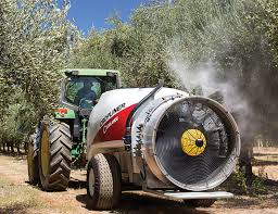 Air-blast sprayer working through an orchard block